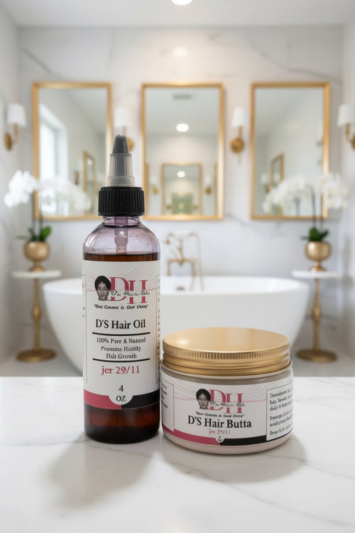 Bottle and jar of D'S Hair Oil and D'S Hair Butta on a bathroom counter.